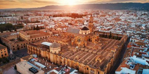 The Mosque–Cathedral of Córdoba aerial closeup view at sunset in Spain.